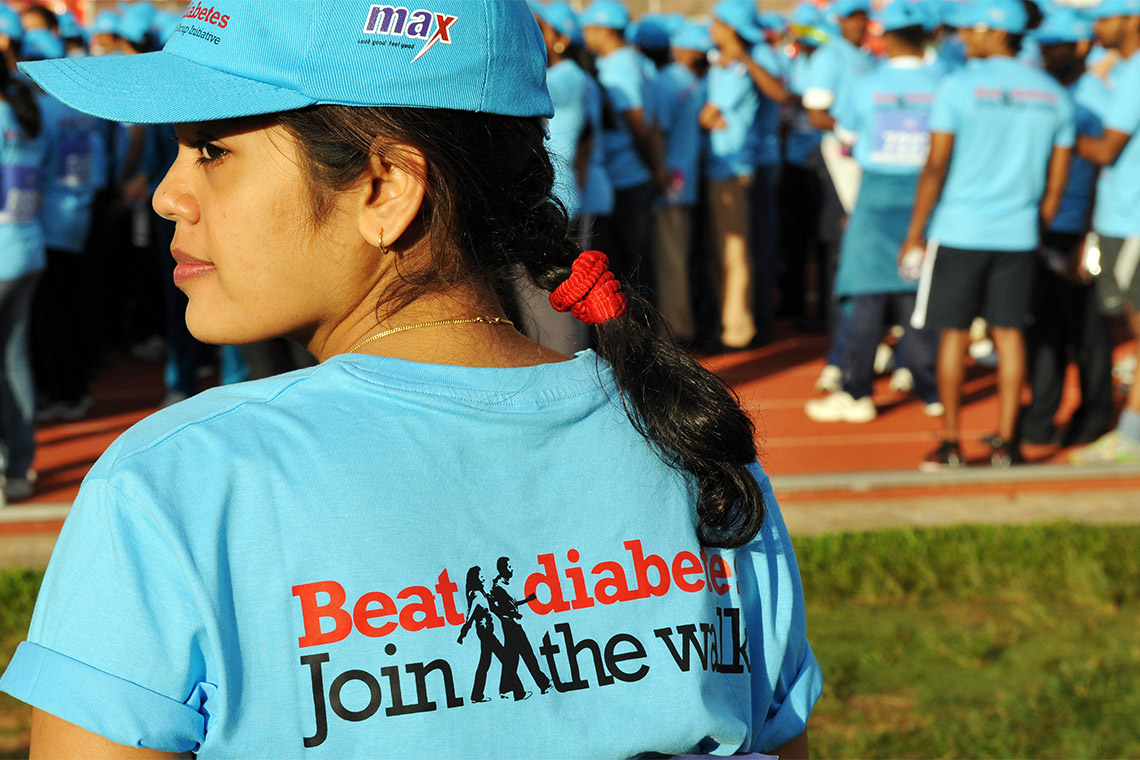A woman wears a "Beat Diabetes" T-shirt during a walkathon that aimed to spread awareness about diabetes in Bangalore, India (photo by Dibyangshu Sarkar/AFP via Getty Images)