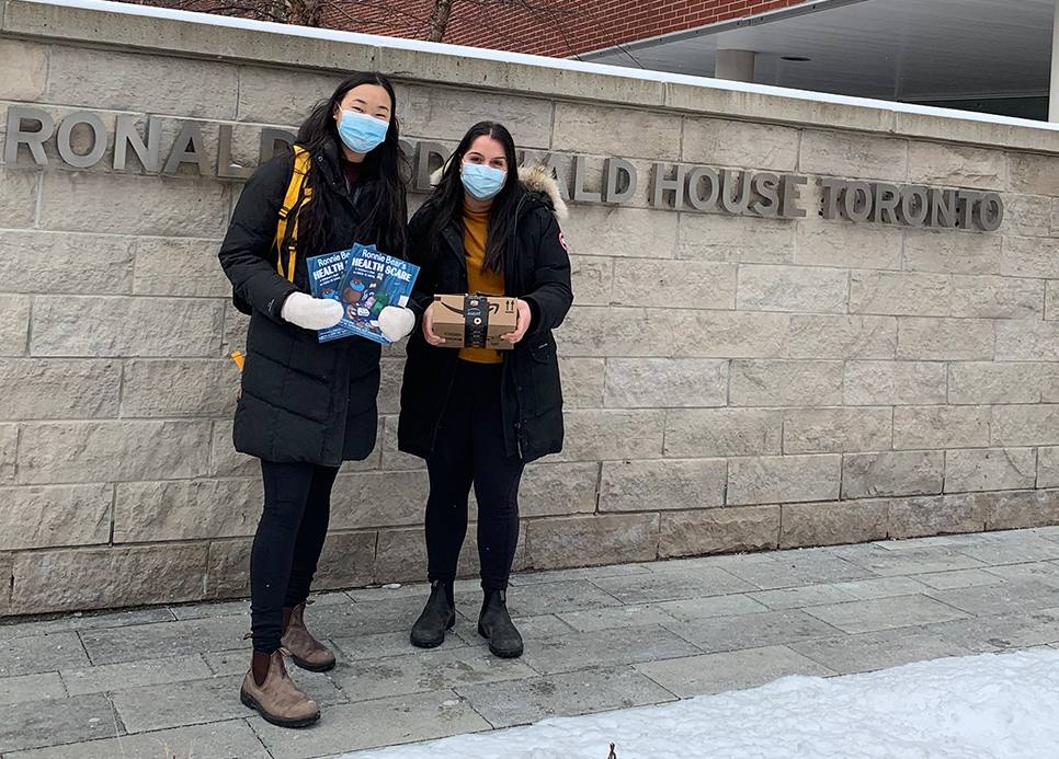 Sabrina Wang and Nairy Khodabakhshian hold books