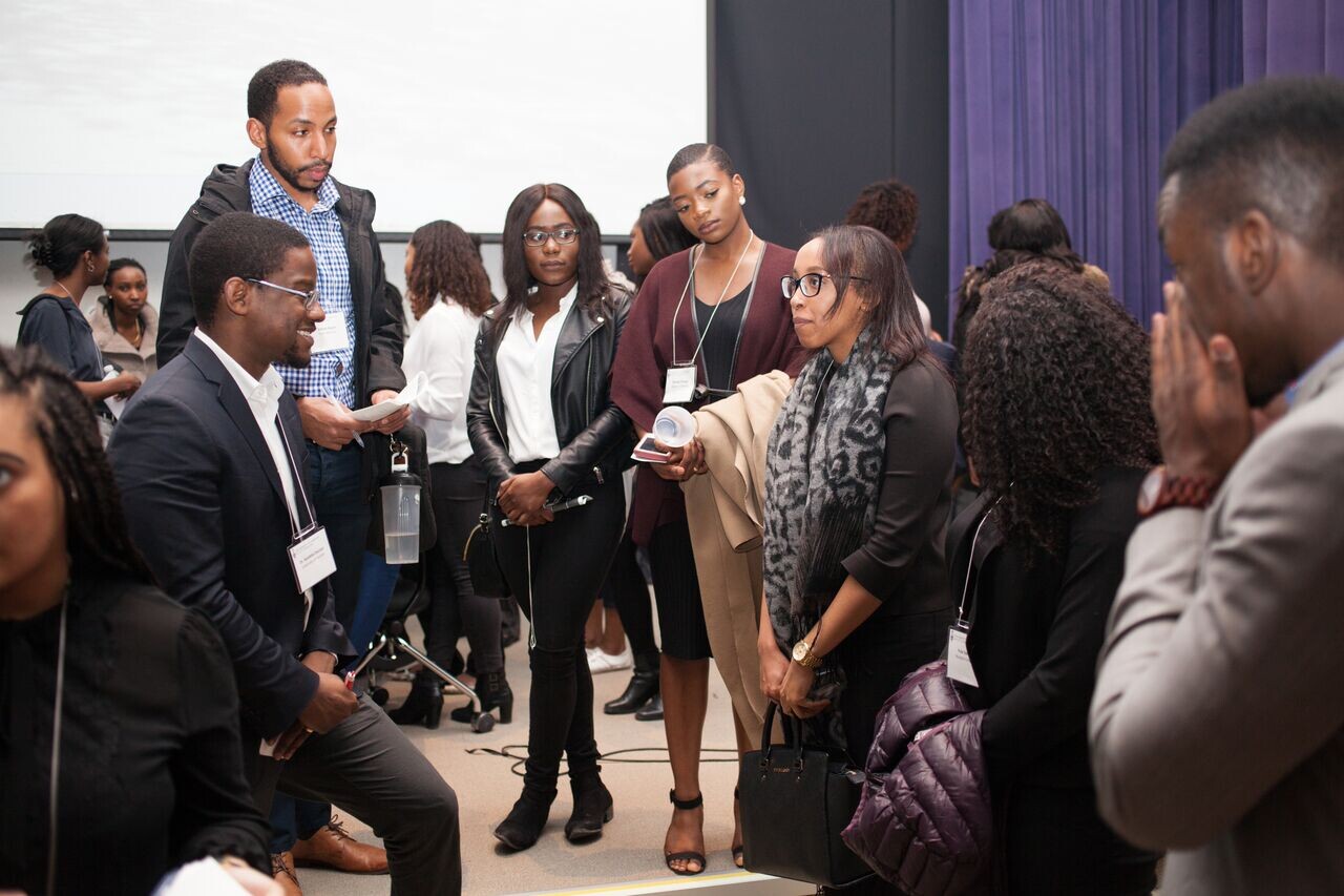 Dr. Ayo Odutayo speaks with students. 